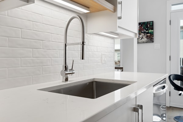 Modern kitchen sink with professional faucet installation
