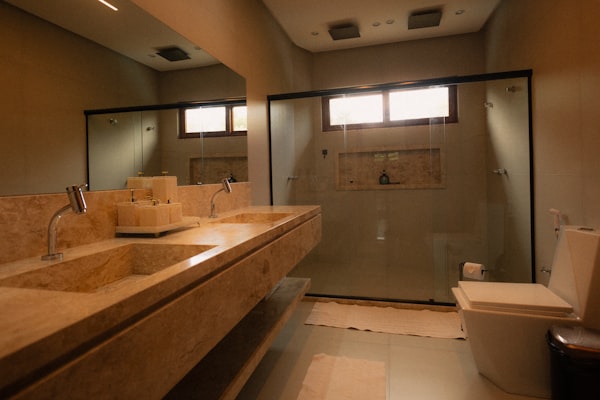 Modern bathroom with double vanity and glass shower
